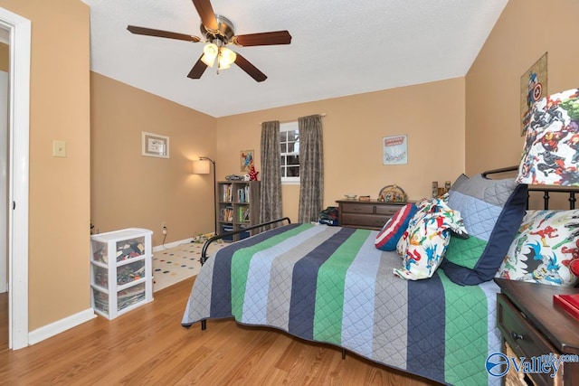 bedroom featuring wood-type flooring and ceiling fan