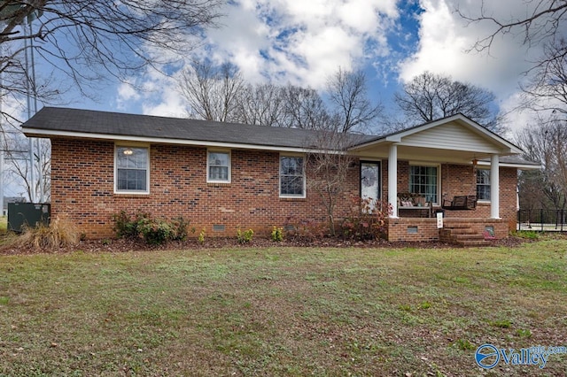 ranch-style house with cooling unit, covered porch, and a front lawn