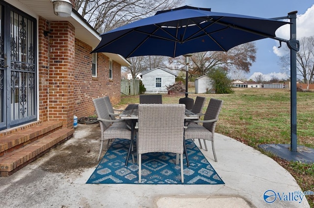 view of patio / terrace with a storage shed