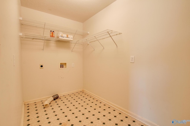 20886 Johnson Dr, Athens, AL 35613 - laundry room with laundry area, hookup for an electric dryer, hookup for a washing machine, tile patterned floors, and baseboards