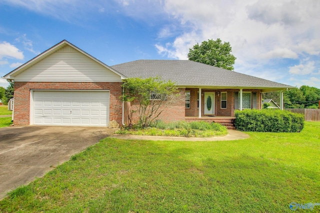 20886 Johnson Dr, Athens, AL 35613 - single story home with covered porch, a garage, a front lawn, brick siding, and driveway