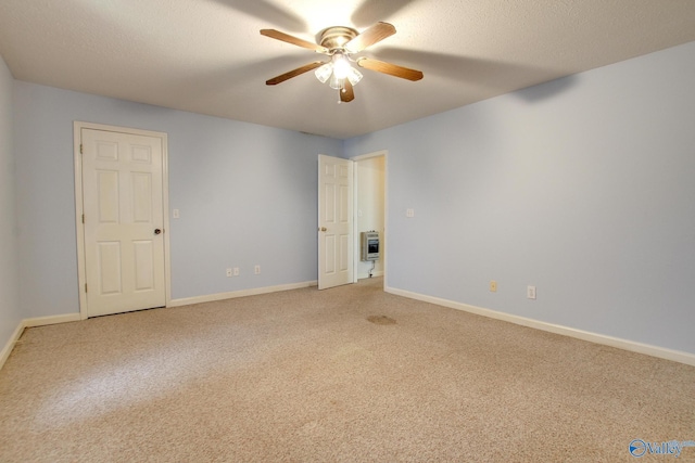 20886 Johnson Dr, Athens, AL 35613 - unfurnished room with heating unit, a textured ceiling, baseboards, ceiling fan, and light carpet