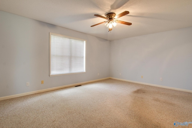20886 Johnson Dr, Athens, AL 35613 - empty room with light colored carpet, visible vents, baseboards, and a ceiling fan