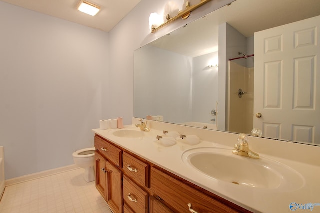 20886 Johnson Dr, Athens, AL 35613 - full bath featuring double vanity, toilet, a bathtub, and a sink