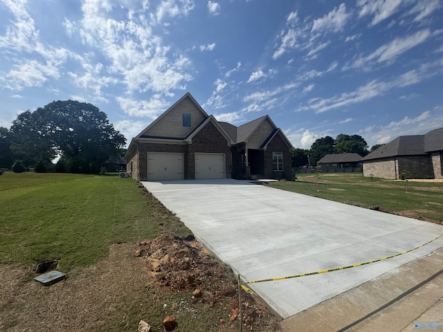 215 Dogwood Dr, Rogersville, AL 35652 - craftsman inspired home with a front yard, driveway, brick siding, and an attached garage