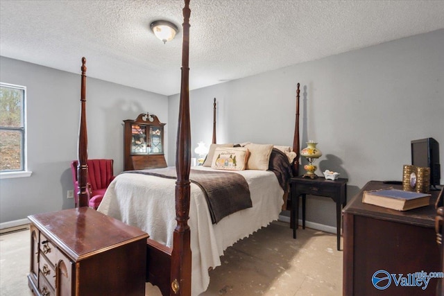 bedroom featuring a textured ceiling