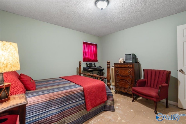 bedroom featuring a textured ceiling