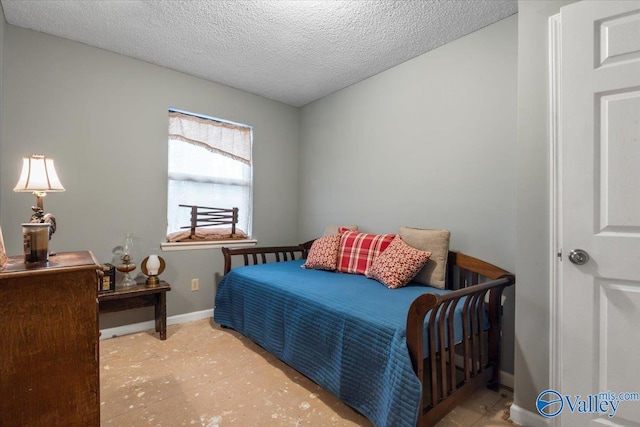 bedroom featuring a textured ceiling