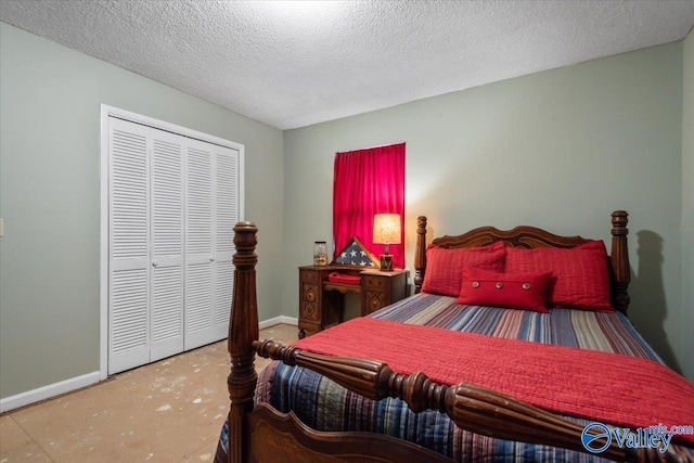 bedroom with a closet and a textured ceiling