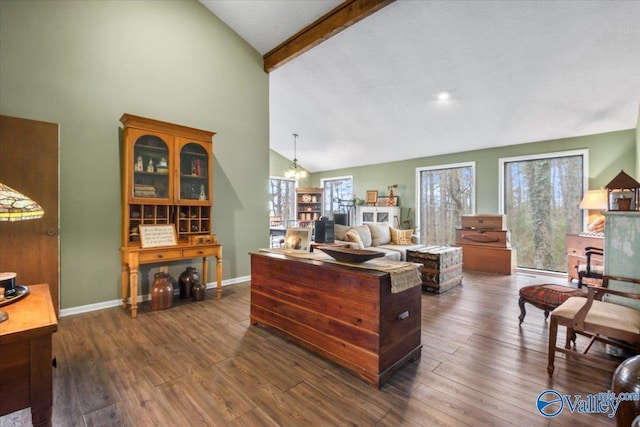 living room with dark hardwood / wood-style flooring, high vaulted ceiling, beamed ceiling, and an inviting chandelier