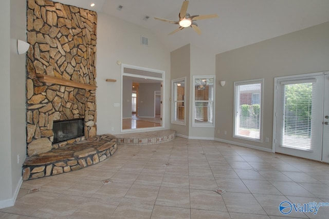 1102 Chesterfield Dr SE, Huntsville, AL 35803 - unfurnished living room with a ceiling fan, high vaulted ceiling, tile patterned floors, a fireplace, and baseboards