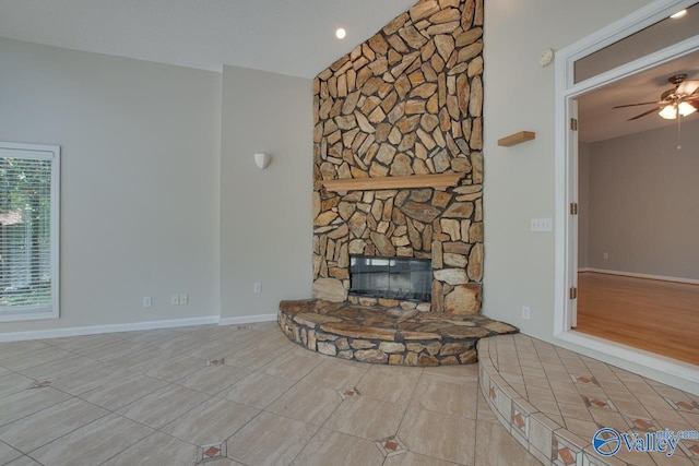 1102 Chesterfield Dr SE, Huntsville, AL 35803 - unfurnished living room with lofted ceiling, ceiling fan, a fireplace, baseboards, and tile patterned flooring