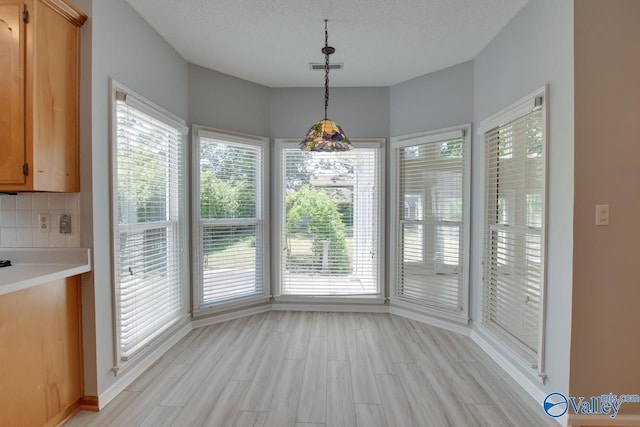 1102 Chesterfield Dr SE, Huntsville, AL 35803 - unfurnished dining area with light wood-type flooring and baseboards