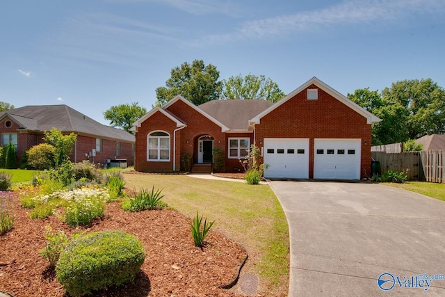 1102 Chesterfield Dr SE, Huntsville, AL 35803 - view of front of home featuring brick siding, a garage, and driveway