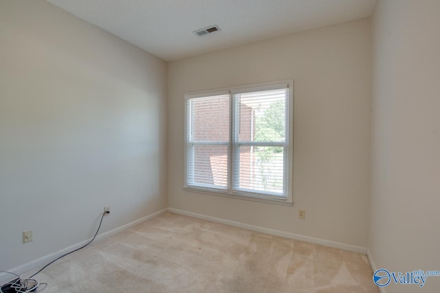 1102 Chesterfield Dr SE, Huntsville, AL 35803 - spare room featuring plenty of natural light, carpet flooring, and baseboards