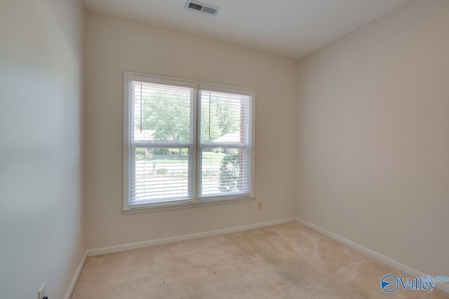 1102 Chesterfield Dr SE, Huntsville, AL 35803 - spare room featuring plenty of natural light, carpet floors, and baseboards
