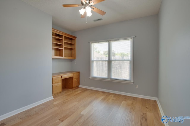 1102 Chesterfield Dr SE, Huntsville, AL 35803 - unfurnished office featuring built in desk, a ceiling fan, light wood-style flooring, and baseboards