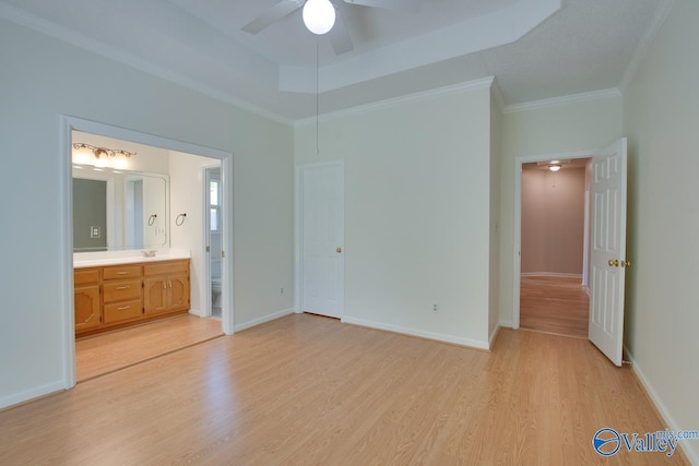 1102 Chesterfield Dr SE, Huntsville, AL 35803 - unfurnished bedroom featuring light wood-style flooring, ensuite bath, ornamental molding, a sink, and baseboards