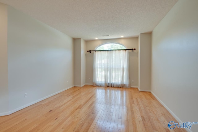 1102 Chesterfield Dr SE, Huntsville, AL 35803 - empty room featuring wood finished floors, a textured ceiling, baseboards, and recessed lighting
