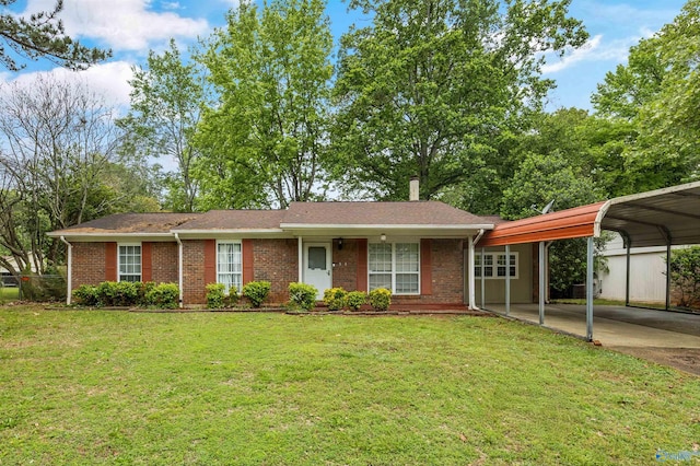 single story home featuring roof with shingles, brick siding, a front yard, a detached carport, and driveway