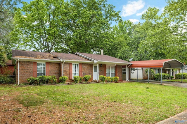 single story home with fence, brick siding, a front yard, a detached carport, and driveway