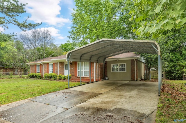 single story home featuring fence, a front lawn, brick siding, concrete driveway, and a carport