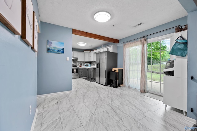 kitchen with visible vents, tasteful backsplash, baseboards, marble finish floor, and stainless steel appliances