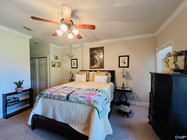 carpeted bedroom featuring crown molding, a closet, and ceiling fan