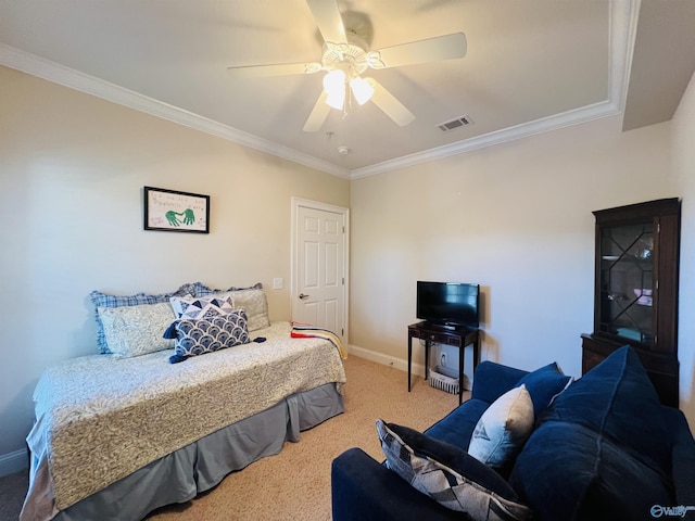 carpeted bedroom featuring ornamental molding and ceiling fan