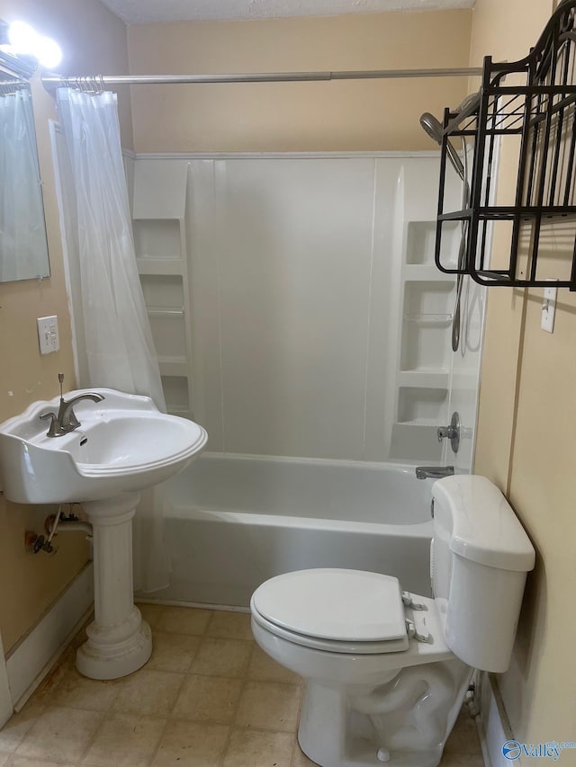 full bathroom featuring shower / tub combo and toilet
