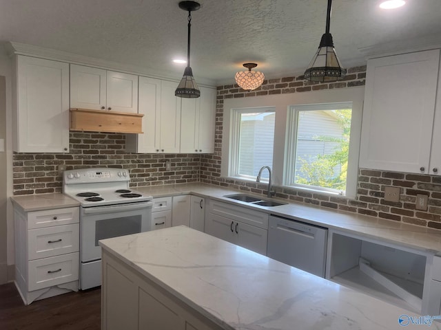 kitchen with tasteful backsplash, a sink, white appliances, white cabinets, and under cabinet range hood
