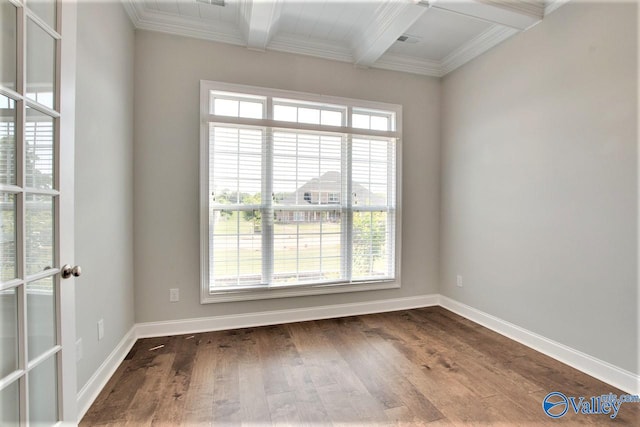 spare room featuring crown molding, hardwood / wood-style flooring, a healthy amount of sunlight, and beam ceiling