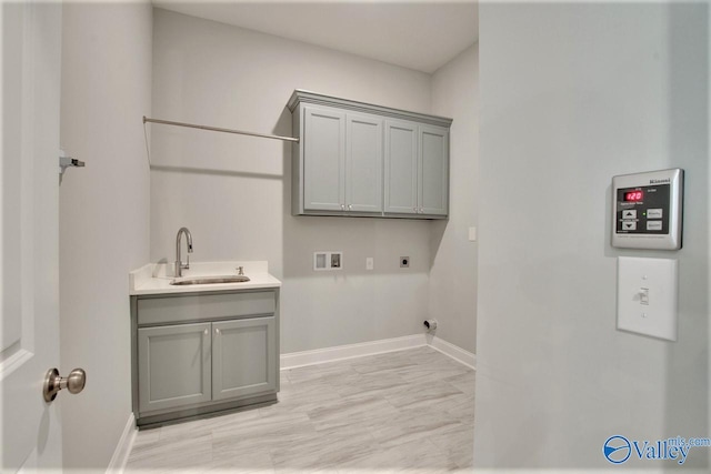 laundry area with washer hookup, cabinets, sink, and hookup for an electric dryer