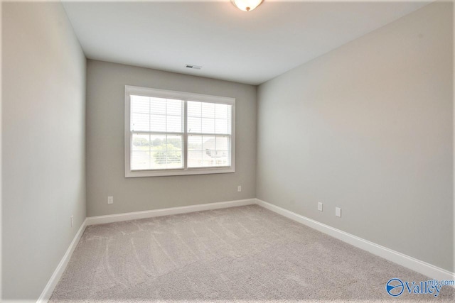 spare room featuring carpet flooring