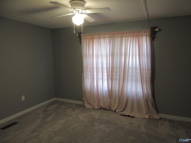 empty room with carpet and ceiling fan