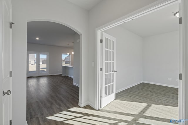 hall featuring hardwood / wood-style floors and french doors