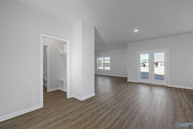 interior space with dark hardwood / wood-style flooring and french doors