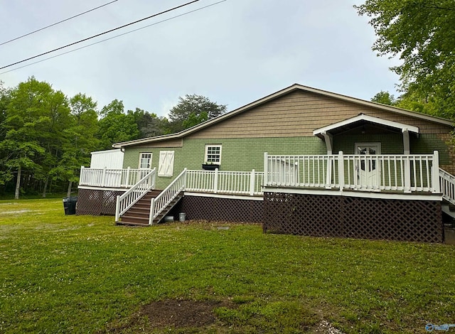 1046 Susan Dr, Fort Payne, AL 35967 - back of property with a deck and a yard