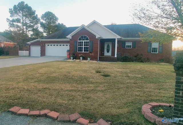 view of front of property featuring a garage and a front lawn