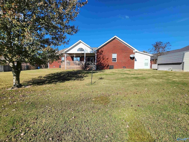 view of front of house with a front yard and a porch