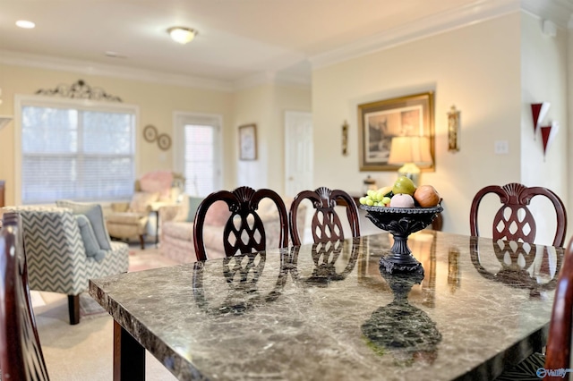 dining room with crown molding