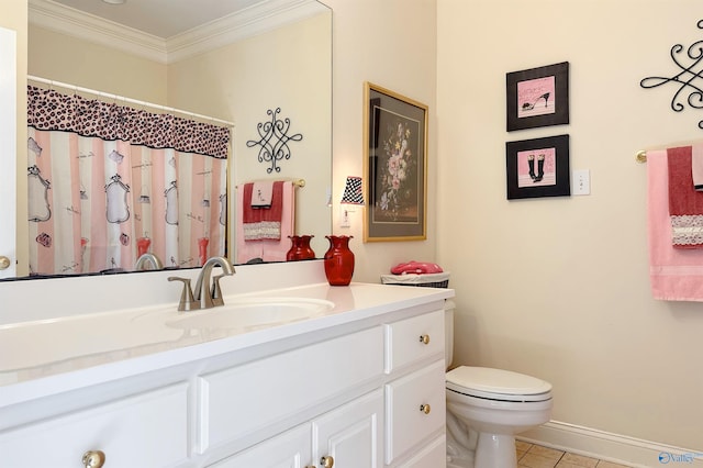 bathroom featuring tile patterned floors, vanity, toilet, and crown molding