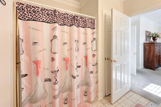 bathroom featuring crown molding and tile patterned flooring