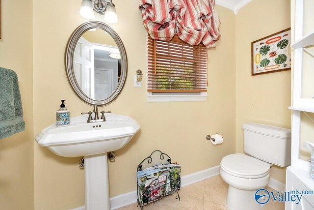3318 Ohara Rd SW, Huntsville, AL 35801 - half bath with baseboards, toilet, and tile patterned flooring