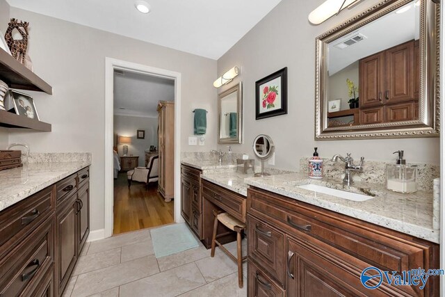 bathroom with hardwood / wood-style flooring and vanity