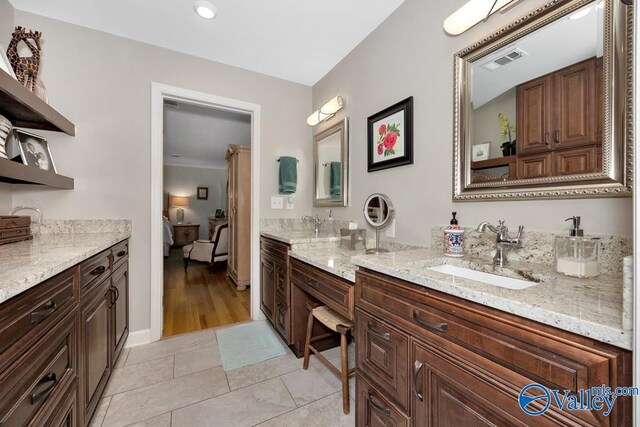3318 Ohara Rd SW, Huntsville, AL 35801 - ensuite bathroom featuring baseboards, visible vents, ensuite bathroom, and vanity