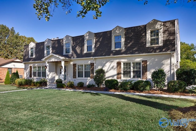 3318 Ohara Rd SW, Huntsville, AL 35801 - cape cod home featuring brick siding, a front lawn, mansard roof, and roof with shingles