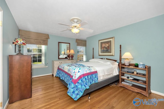 bedroom featuring wood-type flooring and ceiling fan