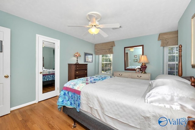 bedroom with ceiling fan and light hardwood / wood-style floors