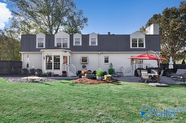 3318 Ohara Rd SW, Huntsville, AL 35801 - back of property featuring fence, a patio area, and a yard